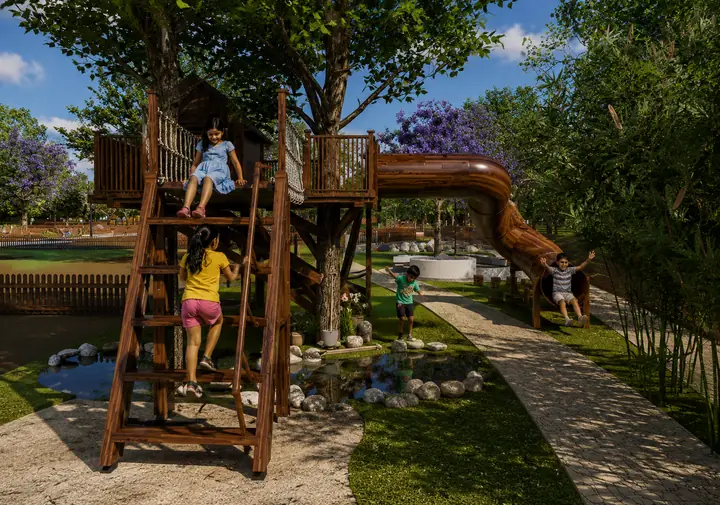 Kids climbing the play tower